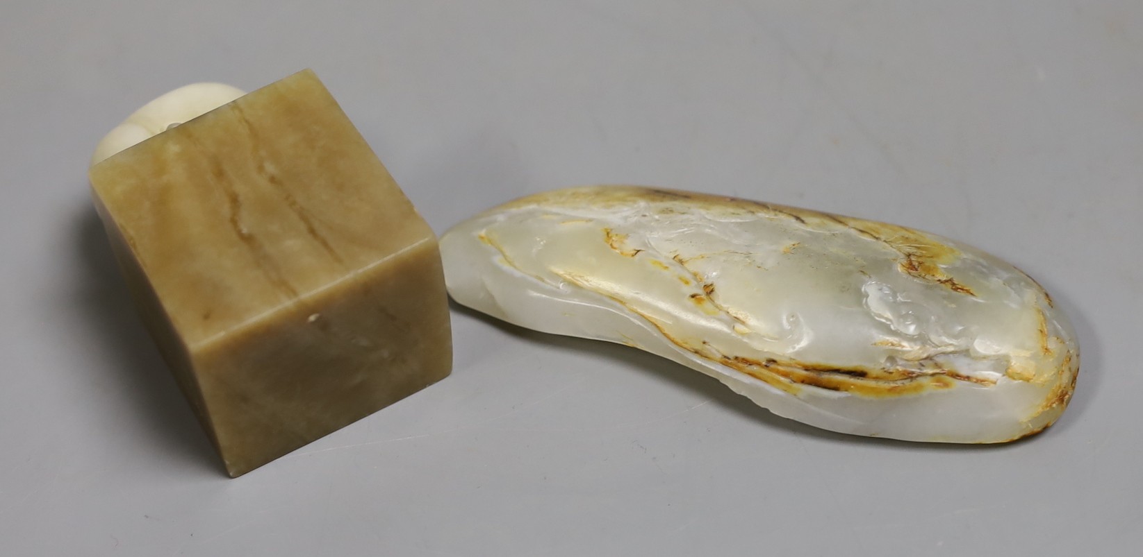 A Chinese hardstone seal and a luohan carving, 13cm tall, (2)